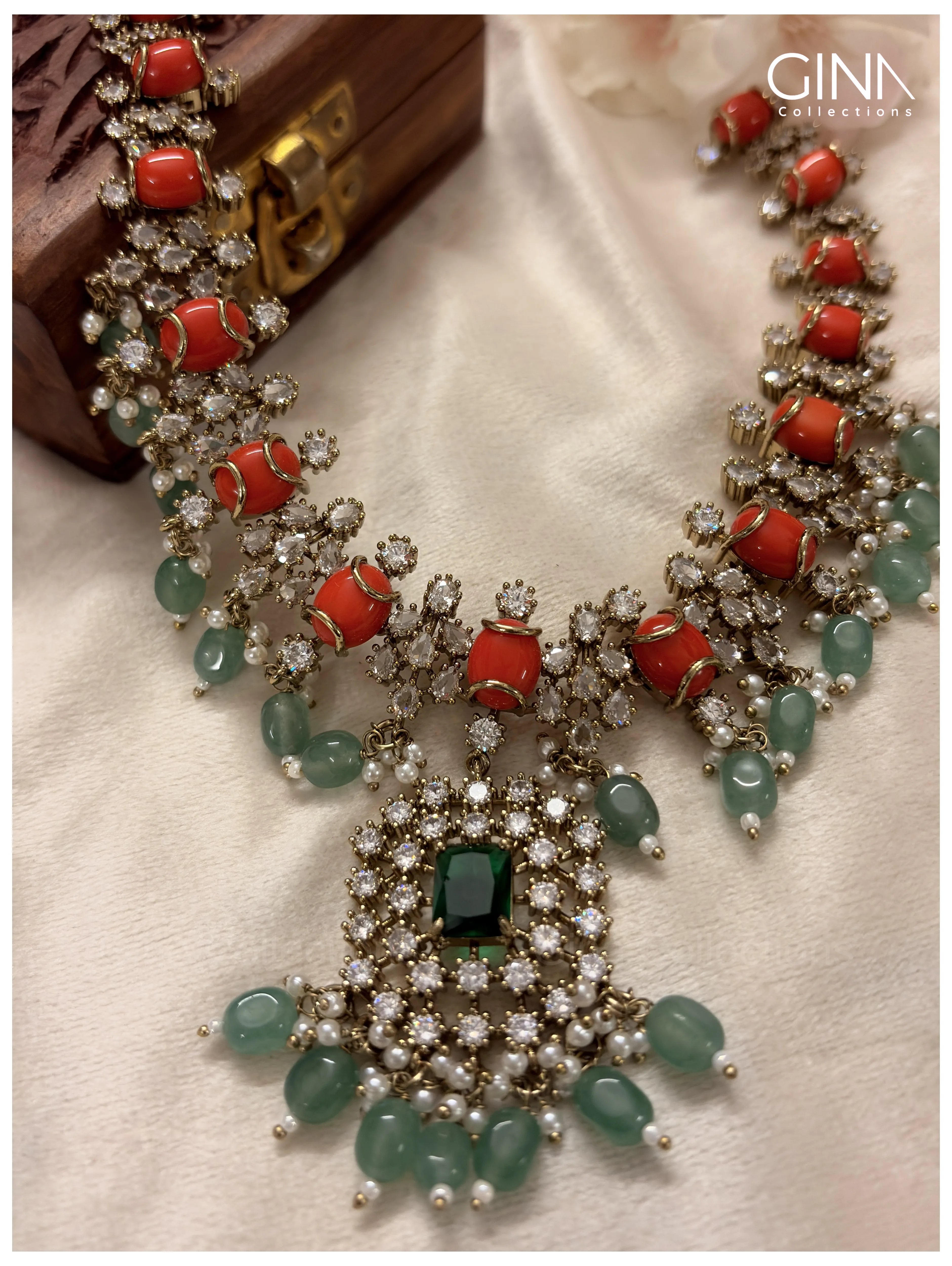 Shimmering Pavazham with Emerald Drops