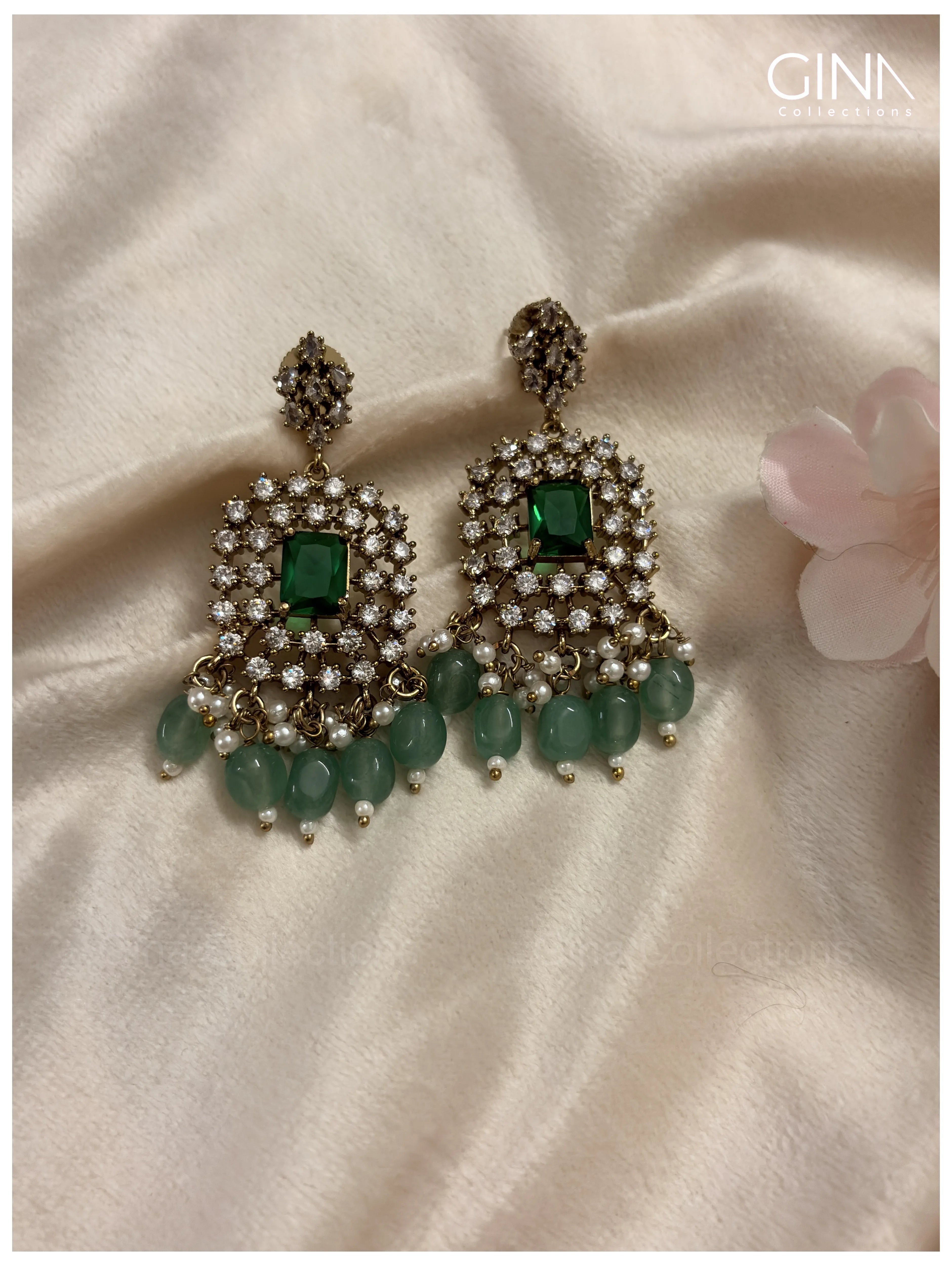 Shimmering Pavazham with Emerald Drops